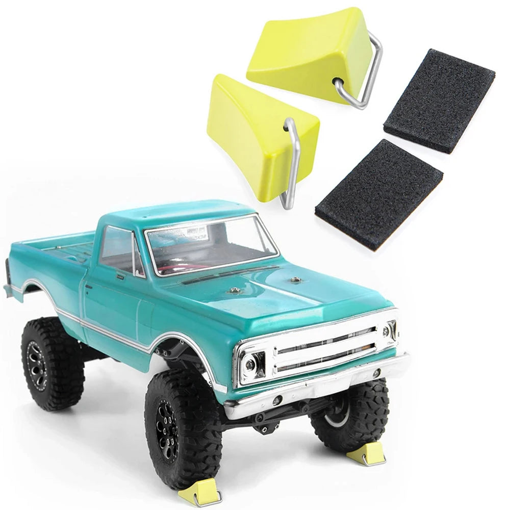 A teal 1/18 scale RC truck is shown next to a yellow mini jack stand and tool set.