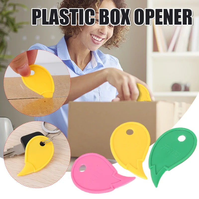 A person is using a yellow plastic box opener to open a cardboard box, with various colored plastic openers displayed below.