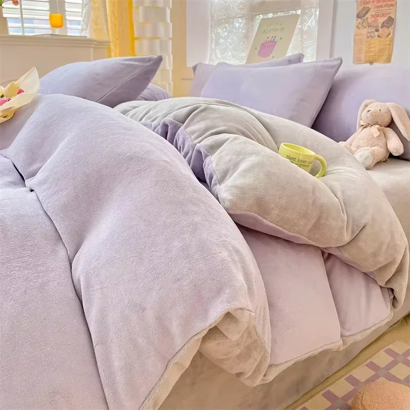 A cozy milk velvet bedding set featuring a duvet cover and pillows in soft lavender and beige tones.