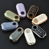A collection of luxury leather key cases in various colors and finishes for Fiat and Citroen models.