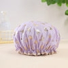 A lavender reusable elastic shower cap adorned with gold butterfly patterns.