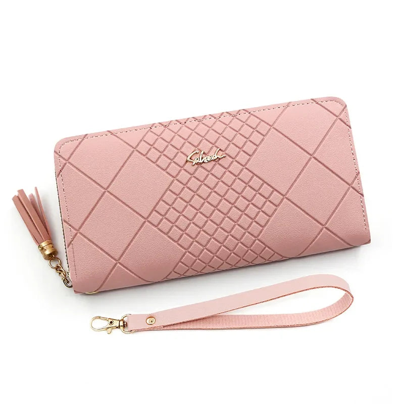 A pink quilted PU leather wristlet clutch wallet with a gold chain and strap.