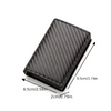 A black slim leather card holder with a textured pattern shown from the top angle.