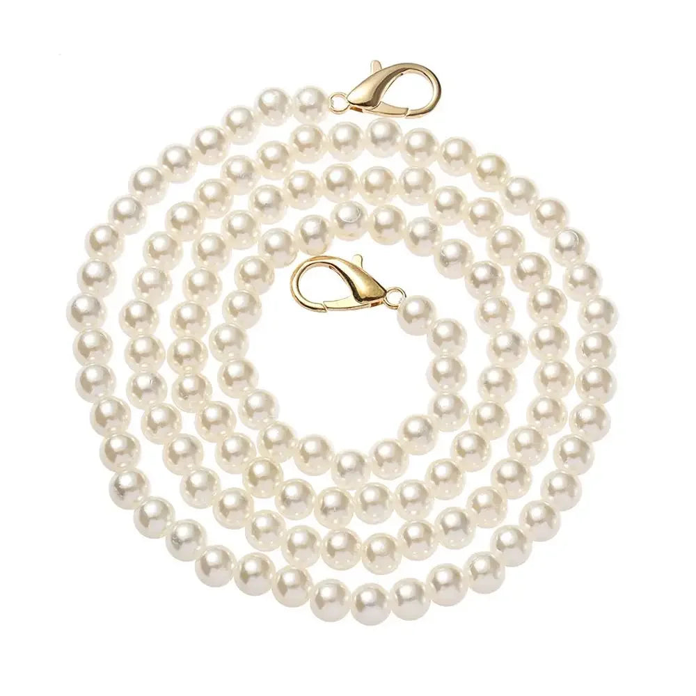 A strand of white pearls used as a strap replacement for handbags.