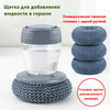 A grey press dish brush with a built-in soap dispenser, shown in various sizes.