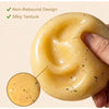 A hand holds a yellow potato slushie squishy toy with a silky texture and non-rebound design.