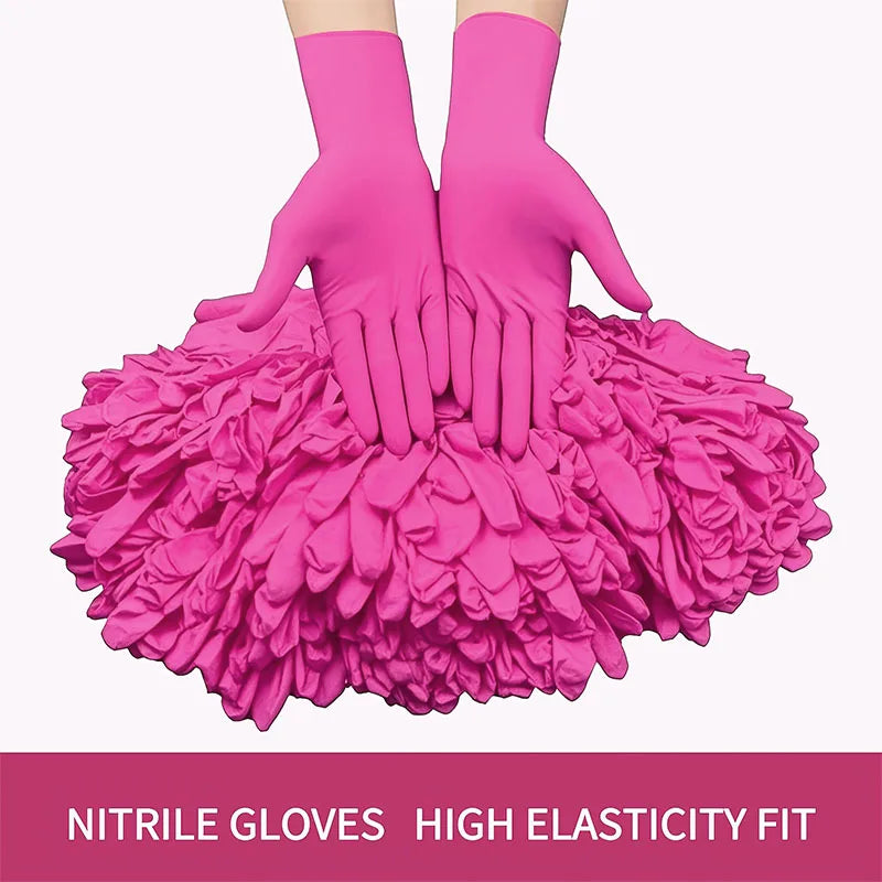 A pair of bright pink nitrile gloves are shown with a voluminous pile of matching pink fabric below them.