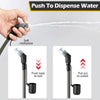 A hand is using a soft mouthpiece to dispense water from a collapsible hydration bladder.