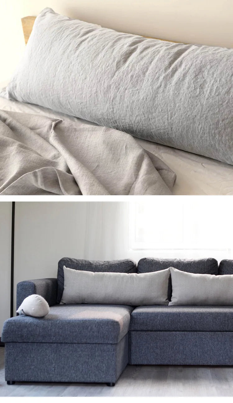 A light gray linen pillowcase is shown folded on a bed, next to a gray sofa.