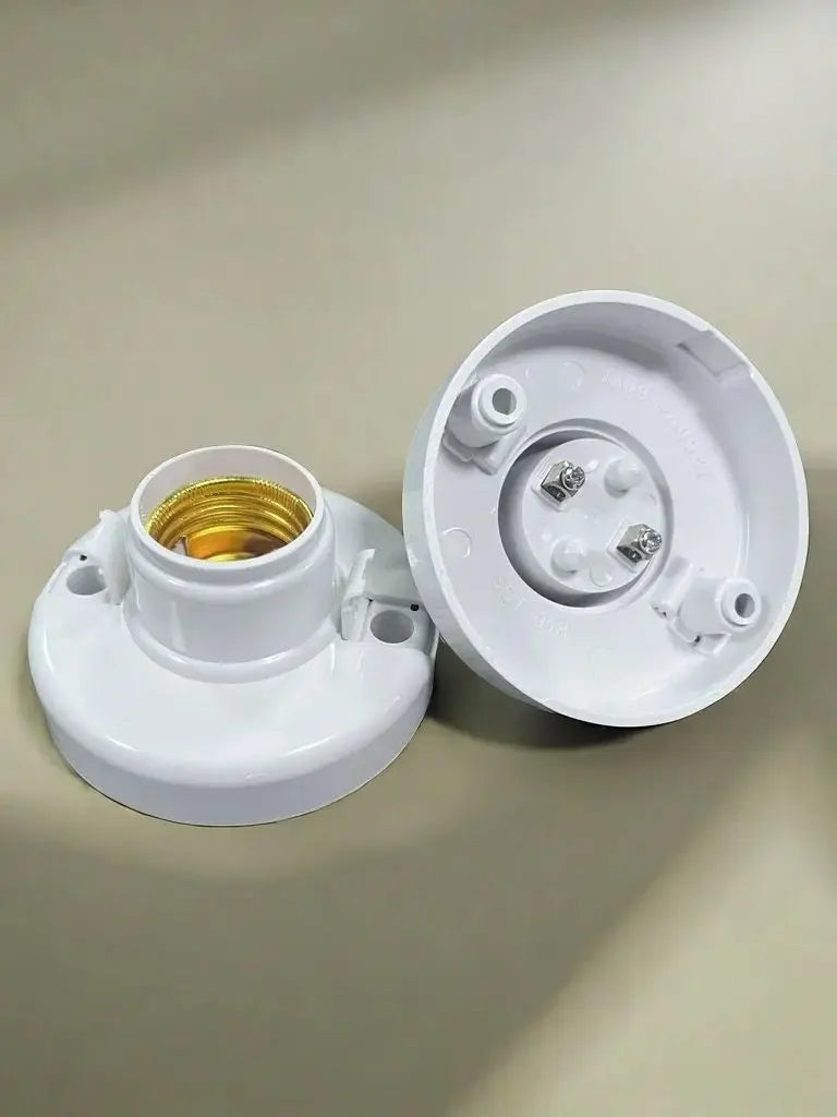A white E27 screw cap light bulb holder with a brass socket and mounting posts.