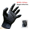 A black heavy-duty disposable nitrile glove with a diamond texture shown on a hand, next to a bundle of gloves.