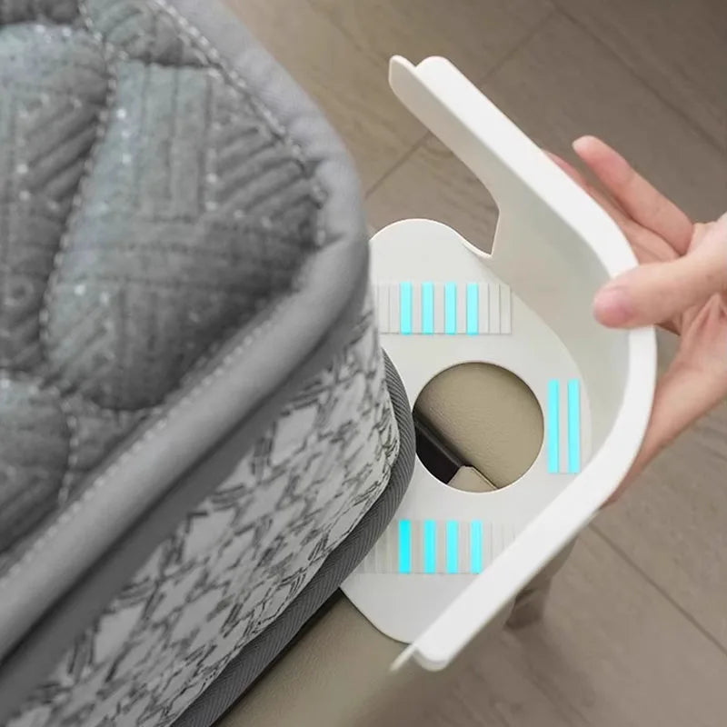 A hand is holding a white bed sheet fixing clip, showing the mechanism for securing bedding.
