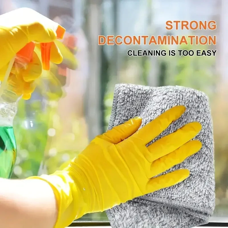 A hand wearing a yellow cleaning glove is wiping a gray cloth, demonstrating strong decontamination for kitchen cleaning.