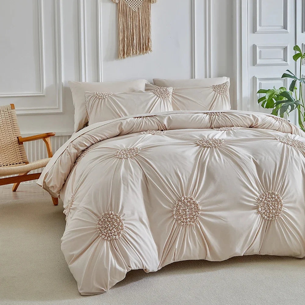 A beige three-dimensional pleated floral duvet cover set displayed on a bed against a white paneled wall.
