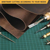 Coffee brown crazy horse leather for crafting is shown rolled and cut with a leather cutting tool on a green cutting mat