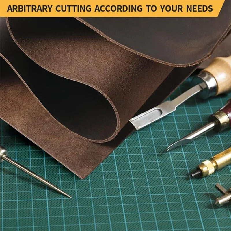 Coffee brown crazy horse leather for crafting is shown rolled and cut with a leather cutting tool on a green cutting mat