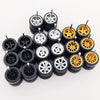 Ten pairs of 1:64 scale alloy car wheels and tires displayed on a white background.