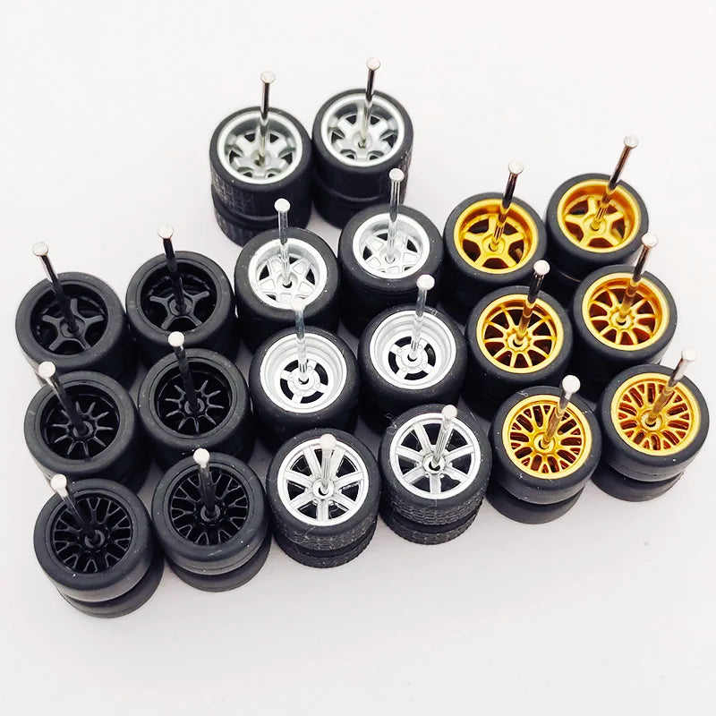 Ten pairs of 1:64 scale alloy car wheels and tires displayed on a white background.