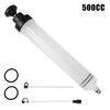 A clear syringe with a black plunger and various clear tubes for manual fuel transfer or oil extraction.
