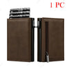 A brown leather pop-up wallet with a card holder and zipper visible.
