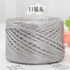 A spool of silver metallic flat ribbon yarn for crochet and knitting.