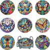A collection of eight colorful butterfly-themed diamond art coasters and a holder kit.