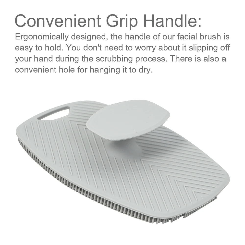 A white silicone body scrubber and massage brush with a convenient grip handle.