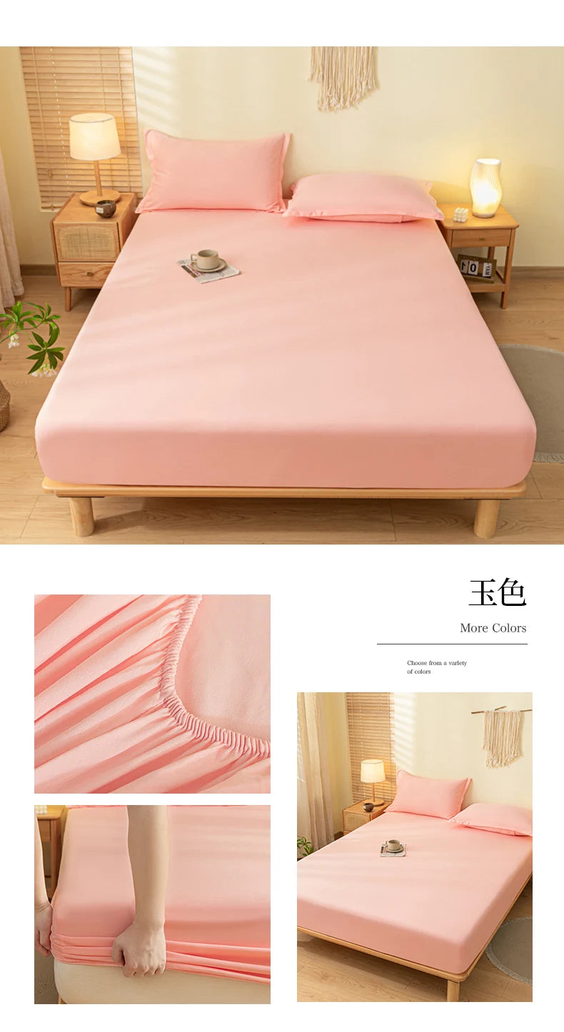 A pink fitted sheet is displayed on a wooden bed frame with soft fabric and elastic edges.