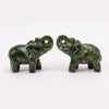 A pair of hand-carved natural jade elephant statues in green.
