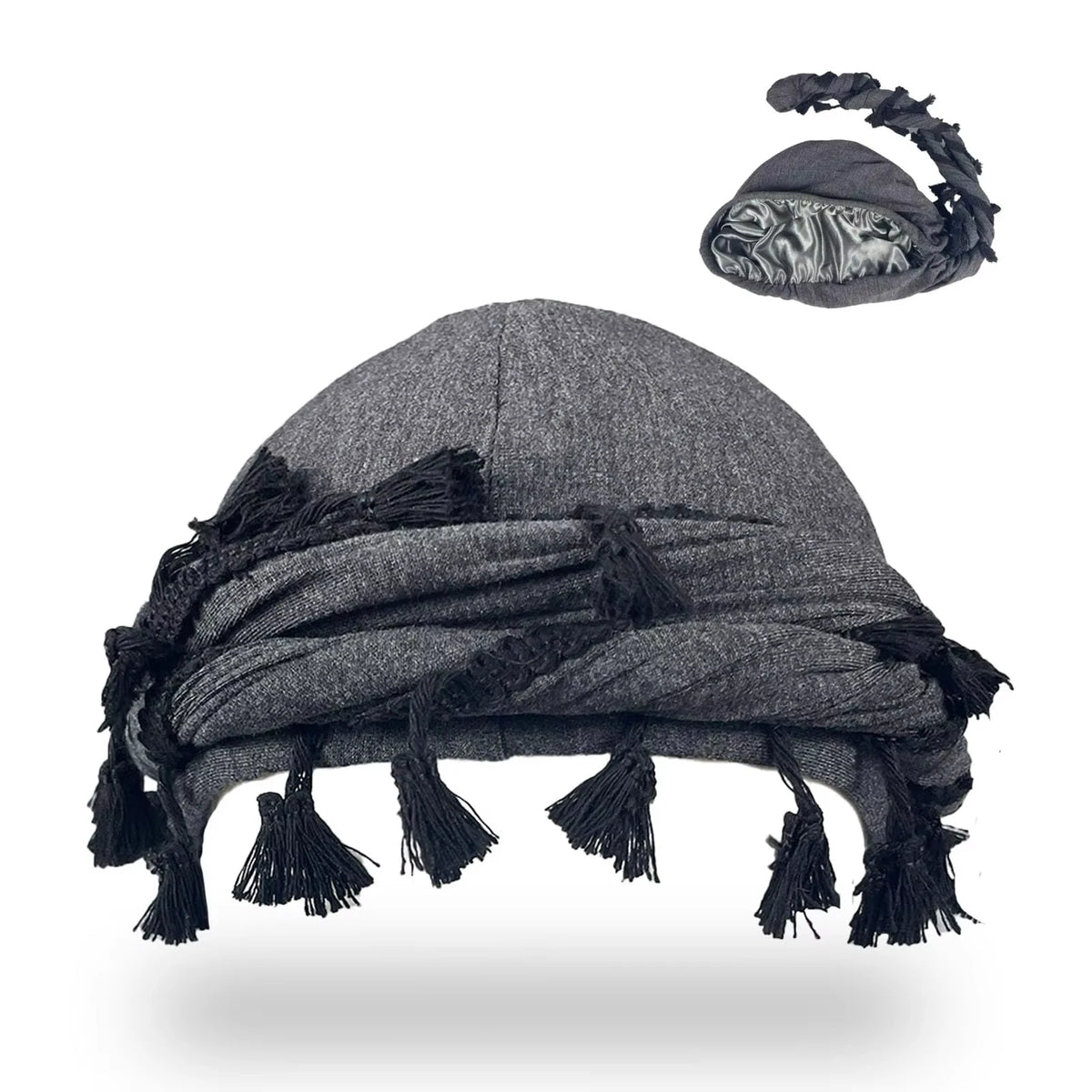 A dark gray vintage twist head wrap with black tassels shown flat.