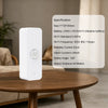 A white smart motion sensor device with a circular lens and specification details is placed on a wooden table.