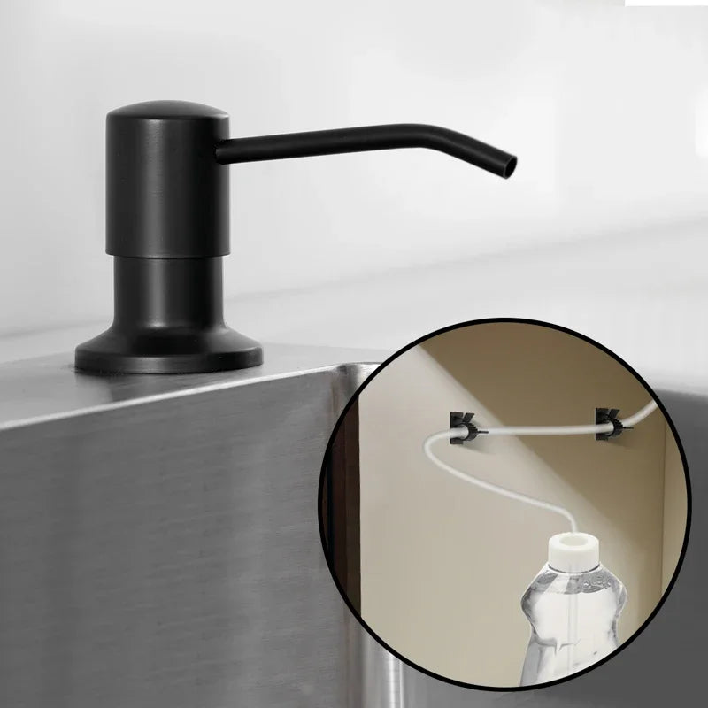 A black faucet with an extension tube is mounted on a stainless steel countertop sink.