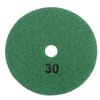 A circular green polishing pad with a central hole, used for diamond polishing of stone and concrete.