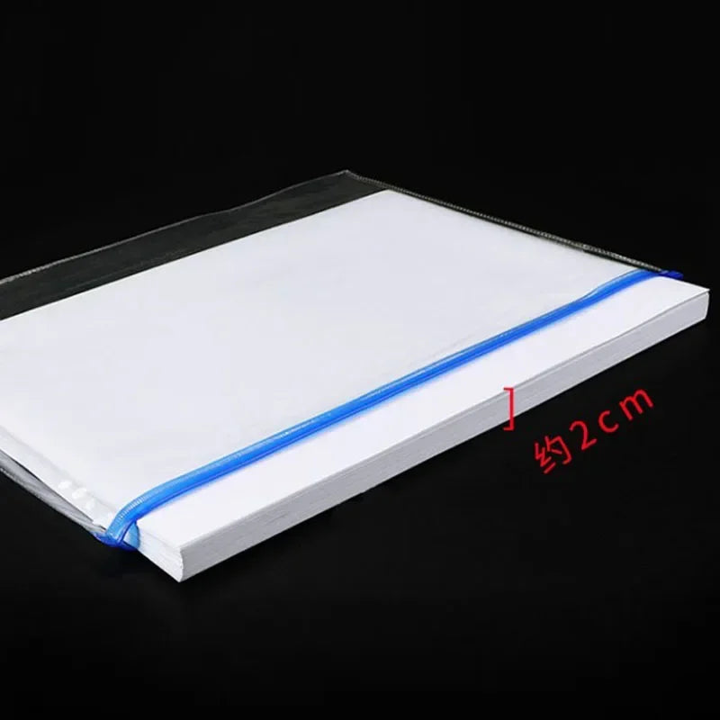 A white A4 document organizer with blue binding and pockets shown flat on a dark surface.