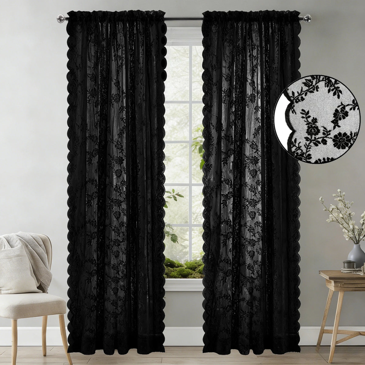 Black vintage floral lace sheer curtains in two panels hanging in a window.