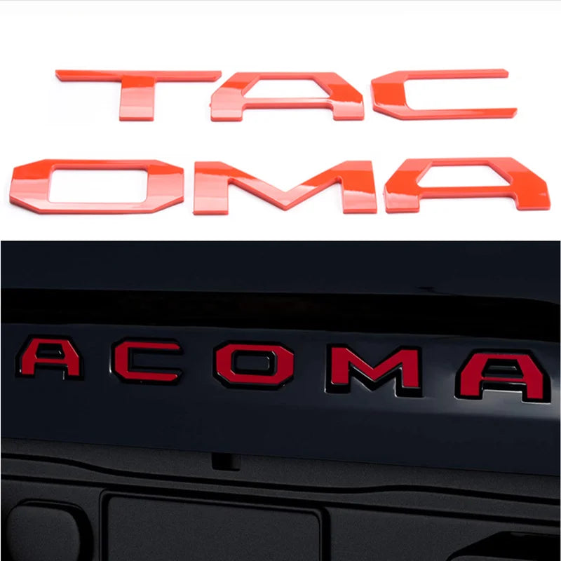 A set of orange 3D letter emblems for a Toyota Tacoma tailgate, spelling out TACOMA.