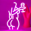 A bright pink neon silhouette of a female figure is displayed against a magenta background.