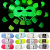 A collection of glow-in-the-dark polyester yarn in various colors including green, pink, and white.