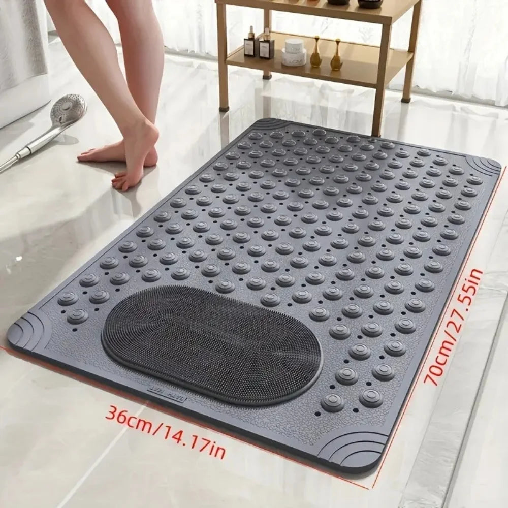 A gray non-slip bath mat with massage nodes is placed on a glossy white floor.