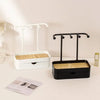 Elegant jewelry display rack with a drawer and wooden base featuring black and white components.