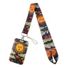 A black and orange patterned lanyard featuring a sun design attached to an ID badge holder.