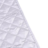 A close-up view of a white quilted ironing mat fabric.