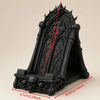 Black gothic skull phone stand featuring intricate thorn details and a decorative arch design.