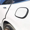 Black U-shaped rubber edge trim with a metal core installed on the side of a white car door.