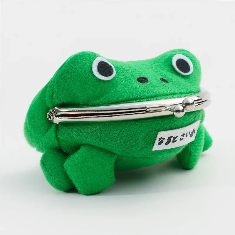 A bright green plush frog with large eyes and a silver coin purse attached to its body.