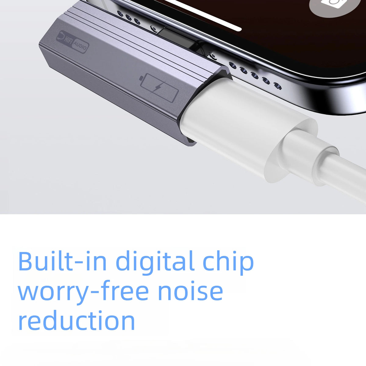 A silver USB-C to 3.5mm audio adapter with a white cable is shown connected to a smartphone.