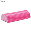 Pink half-round EVA foam roller for muscle relief and yoga balance