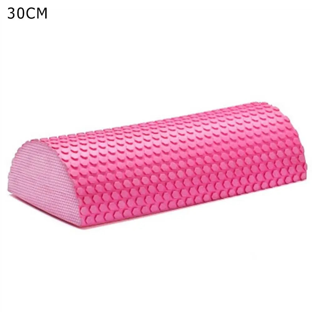 Pink half-round EVA foam roller for muscle relief and yoga balance