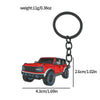 A red Ford Bronco zinc alloy keychain with a black split ring.