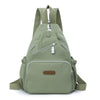 A olive green waterproof nylon crossbody sling bag with adjustable straps and multiple pockets.
